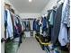 This walk-in closet has clothes and shoes organized on shelving on both sides and at the far end at 90 Cerro St, Atlanta, GA 30314