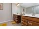 Bathroom features a double vanity with plenty of storage space and a large mirror at 1427 Lanier Vista Dr, Sugar Hill, GA 30518