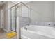 Bathroom with a separate tub and shower provides the perfect space to unwind at 1427 Lanier Vista Dr, Sugar Hill, GA 30518