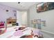 This bedroom features playful wall decals and cozy decor at 1427 Lanier Vista Dr, Sugar Hill, GA 30518