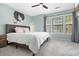 Serene bedroom with ample natural light and a comfortable queen-sized bed at 1427 Lanier Vista Dr, Sugar Hill, GA 30518