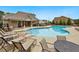 Community pool with plenty of lounge chairs and tables for the residents to enjoy at 1427 Lanier Vista Dr, Sugar Hill, GA 30518