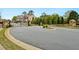 Gated community entrance with stone accents and landscaping at 1427 Lanier Vista Dr, Sugar Hill, GA 30518