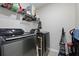 Functional laundry area with modern washer and dryer units at 1427 Lanier Vista Dr, Sugar Hill, GA 30518