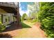 Backyard view with lush landscaping at 2171 W Village Se Ln, Smyrna, GA 30080