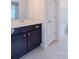 Modern bathroom featuring a vanity with dark cabinets and a white countertop at 2171 W Village Se Ln, Smyrna, GA 30080