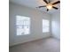 Bright bedroom with two windows and a ceiling fan at 2171 W Village Se Ln, Smyrna, GA 30080