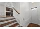 Grand entryway boasts gleaming hardwood floors and seamlessly connects to the open kitchen at 2171 W Village Se Ln, Smyrna, GA 30080