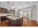 Modern kitchen with stainless steel appliances, a kitchen island, and an adjacent breakfast area at 2171 W Village Se Ln, Smyrna, GA 30080