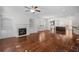Spacious living room with hardwood floors, fireplace, and built-in bookshelves at 2171 W Village Se Ln, Smyrna, GA 30080