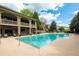 Luxury pool with relaxing lounge chairs with views of the clubhouse at 2171 W Village Se Ln, Smyrna, GA 30080