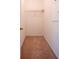 Empty walk-in closet with single top shelf at 2171 W Village Se Ln, Smyrna, GA 30080
