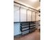 Organized walk-in closet featuring metal shelving and drawers for optimal storage at 2171 W Village Se Ln, Smyrna, GA 30080