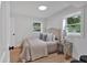 Neutral bedroom with two windows and hardwood floors at 2637 Crestdale Se Cir, Atlanta, GA 30316