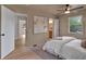 Cozy bedroom features light colored walls, a ceiling fan, and an ensuite bathroom at 2637 Crestdale Se Cir, Atlanta, GA 30316