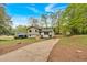 Charming home featuring a well-maintained front yard, long driveway, and ample greenery all around at 2637 Crestdale Se Cir, Atlanta, GA 30316