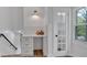 Bright hallway features a built-in desk with drawers, stylish decor, and glass door at 2637 Crestdale Se Cir, Atlanta, GA 30316