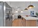Bright kitchen with stainless steel appliances, center island, pendant lighting, and modern finishes at 2637 Crestdale Se Cir, Atlanta, GA 30316
