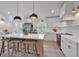 Bright, modern kitchen with large island, stainless steel appliances, and stylish pendant lighting at 2637 Crestdale Se Cir, Atlanta, GA 30316
