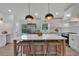 Modern, well-lit kitchen boasts a central island with seating and stainless steel appliances at 2637 Crestdale Se Cir, Atlanta, GA 30316
