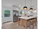 Modern kitchen featuring stainless steel appliances, a large island with seating, and sleek countertops at 2637 Crestdale Se Cir, Atlanta, GA 30316