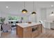 Open kitchen with a large island, pendant lights, and seamless flow to the living area at 2637 Crestdale Se Cir, Atlanta, GA 30316