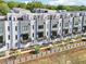 An aerial shot of modern townhomes showcasing the beautiful design and outdoor spaces with lush greenery at 443 Plateau Nw Pl, Atlanta, GA 30309