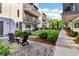 Exterior showcasing a landscaped backyard with seating areas, lush greenery, and a charming pergola at 443 Plateau Nw Pl, Atlanta, GA 30309