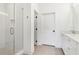 This modern bathroom features a glass shower and a stylish vanity with a sink at 443 Plateau Nw Pl, Atlanta, GA 30309