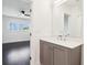 Bathroom featuring a modern vanity and a view into a bedroom with hardwood floors and natural light at 443 Plateau Nw Pl, Atlanta, GA 30309