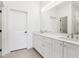 A modern bathroom features double sinks and an oversized mirror above the vanity at 443 Plateau Nw Pl, Atlanta, GA 30309