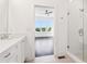 A full bathroom overlooks a spacious bedroom and features a sleek glass shower at 443 Plateau Nw Pl, Atlanta, GA 30309