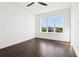 Bright bedroom featuring hardwood floors and city views from the window at 443 Plateau Nw Pl, Atlanta, GA 30309