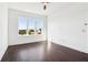 Bedroom features hardwood floors and a large window at 443 Plateau Nw Pl, Atlanta, GA 30309