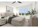 Bedroom with modern decor, neutral tones, and a large window overlooking city at 443 Plateau Nw Pl, Atlanta, GA 30309