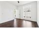 Bright bedroom featuring hardwood floors, white walls, and natural light from a large window at 443 Plateau Nw Pl, Atlanta, GA 30309