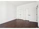 Bedroom featuring hardwood floors and white trim with closet space at 443 Plateau Nw Pl, Atlanta, GA 30309