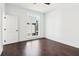 Bedroom featuring hardwood floors, light colored walls, and a large window at 443 Plateau Nw Pl, Atlanta, GA 30309