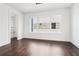 Bonus room featuring hardwood floors, light colored walls, and a large window at 443 Plateau Nw Pl, Atlanta, GA 30309