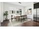 Bright dining area features modern lighting fixture, neutral rug and light colored walls at 443 Plateau Nw Pl, Atlanta, GA 30309