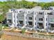 Aerial view of townhomes showing private balconies, landscaping, and modern design at 443 Plateau Nw Pl, Atlanta, GA 30309