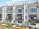 Exterior of modern townhomes with black wrought iron balconies and curated landscaping at 443 Plateau Nw Pl, Atlanta, GA 30309