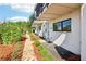 Charming walkway with lush landscaping leading to modern townhomes with inviting entrances and stylish exteriors at 443 Plateau Nw Pl, Atlanta, GA 30309