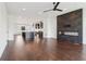 Spacious living room featuring recessed lights, modern fireplace and hardwood floors at 443 Plateau Nw Pl, Atlanta, GA 30309