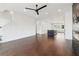 Spacious living room featuring recessed lights, modern fireplace and hardwood floors at 443 Plateau Nw Pl, Atlanta, GA 30309