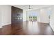 Spacious living room featuring modern fireplace, floor to ceiling windows, and hardwood floors at 443 Plateau Nw Pl, Atlanta, GA 30309