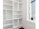 Bright room featuring white shelving, hardwood floors, and a window at 443 Plateau Nw Pl, Atlanta, GA 30309