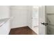 This is a walk-in closet with wire racks and a view into the bathroom at 443 Plateau Nw Pl, Atlanta, GA 30309