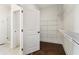 A well-organized walk-in closet with metal shelves and a view into the bathroom at 443 Plateau Nw Pl, Atlanta, GA 30309