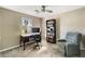 Bright bedroom showcasing a workspace with a desk, chair, and bookshelf at 4568 Oswood Ct, Tucker, GA 30084